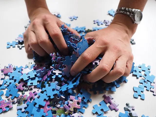 hands holding pieces of the puzzle